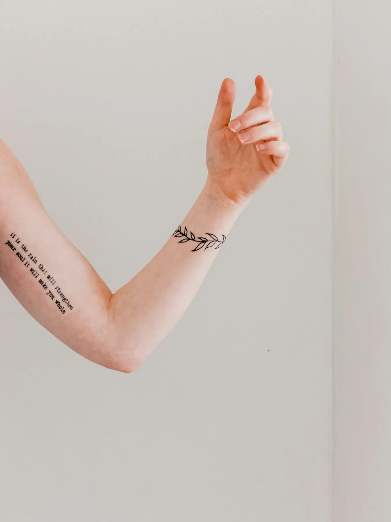 A delicate fine-line script healed on an arm